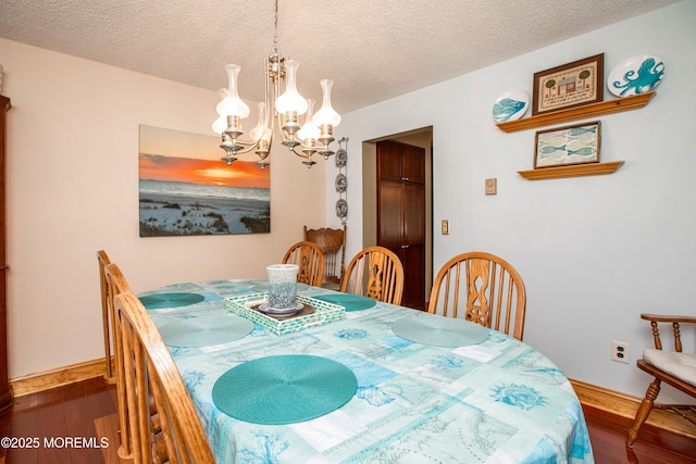 12 Millstream Rd, Cream Ridge, NJ 08514 - dining room featuring baseboards, dark wood finished floors, and an inviting chandelier