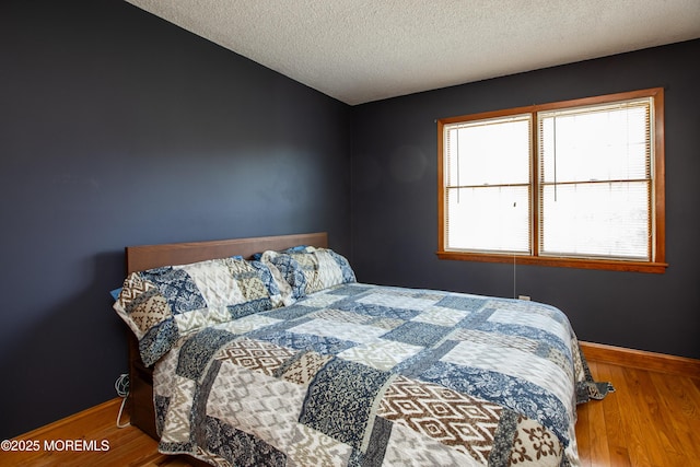 12 Millstream Rd, Cream Ridge, NJ 08514 - bedroom with a textured ceiling, baseboards, and wood finished floors