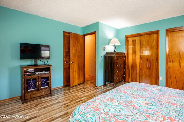 12 Millstream Rd, Cream Ridge, NJ 08514 - bedroom with two closets, wood finished floors, and baseboards