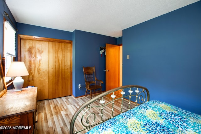 12 Millstream Rd, Cream Ridge, NJ 08514 - bedroom with a textured ceiling, a closet, and wood finished floors