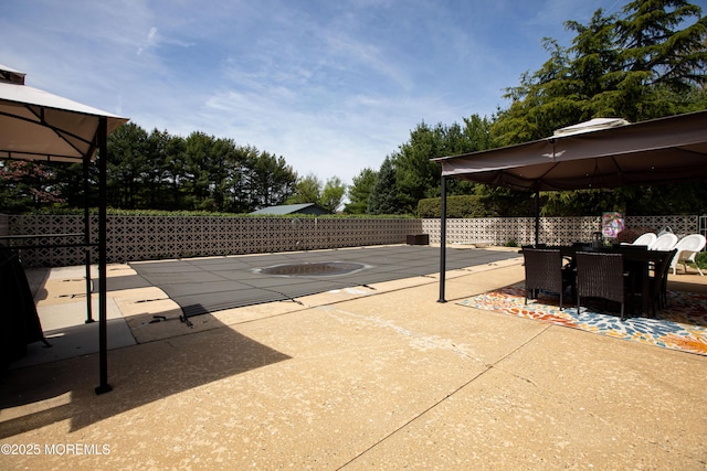 12 Millstream Rd, Cream Ridge, NJ 08514 - view of patio / terrace with a gazebo, outdoor dining space, and fence