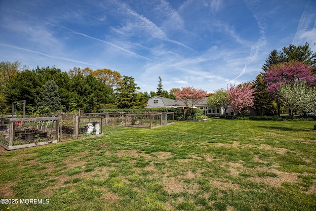 12 Millstream Rd, Cream Ridge, NJ 08514 - view of yard featuring a vegetable garden and fence