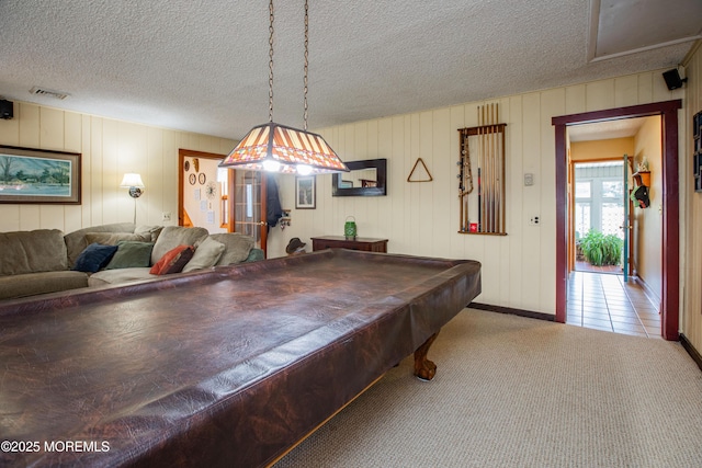 12 Millstream Rd, Cream Ridge, NJ 08514 - game room with a textured ceiling, carpet, baseboards, and visible vents