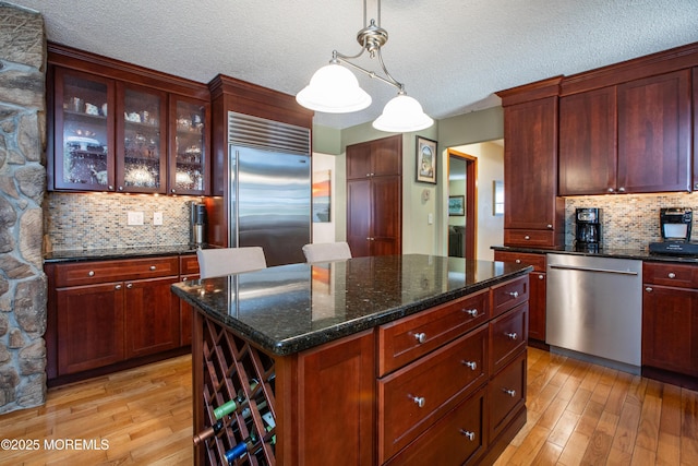 12 Millstream Rd, Cream Ridge, NJ 08514 - kitchen with light wood-type flooring, tasteful backsplash, and appliances with stainless steel finishes