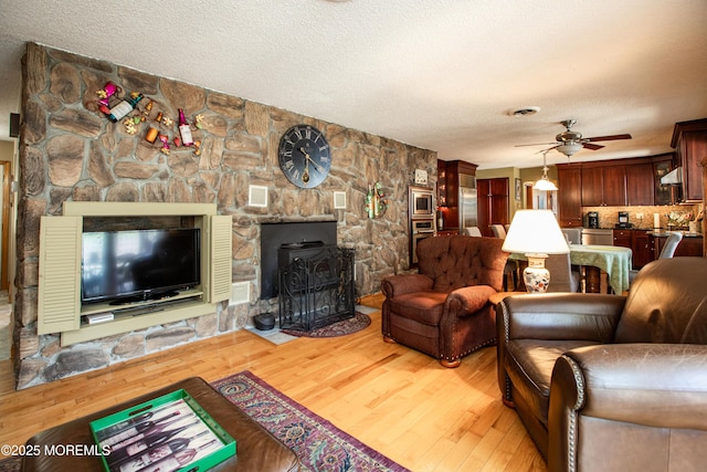 12 Millstream Rd, Cream Ridge, NJ 08514 - living room featuring light wood-type flooring, ceiling fan, and a textured ceiling