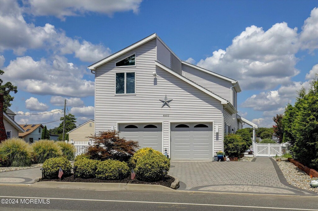 650 Princeton Ave, Brick, NJ 08724 - view of property exterior featuring fence and decorative driveway