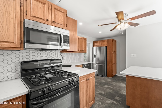 kitchen featuring light countertops, tasteful backsplash, black appliances, and recessed lighting