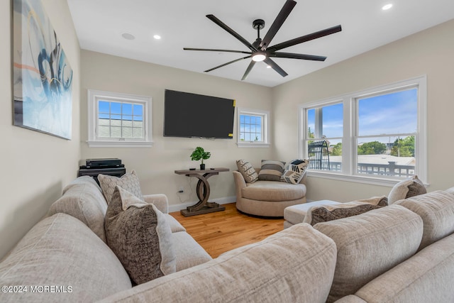 living room with ceiling fan, a wealth of natural light, wood finished floors, and recessed lighting