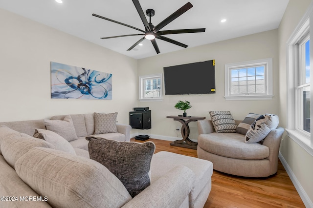 living area featuring recessed lighting, light wood-style floors, and ceiling fan