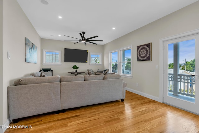 living area with ceiling fan, baseboards, light wood-style floors, and recessed lighting