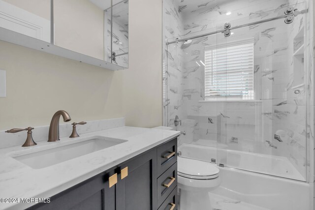 full bathroom featuring vanity, toilet, and enclosed tub / shower combo