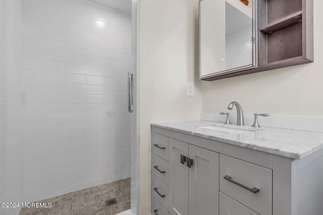 full bathroom with vanity and a stall shower