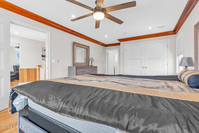 bedroom with light wood finished floors, visible vents, recessed lighting, and ornamental molding