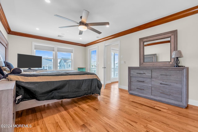 bedroom with light wood-type flooring, baseboards, visible vents, and crown molding