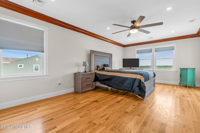 bedroom with crown molding, light wood finished floors, baseboards, visible vents, and recessed lighting