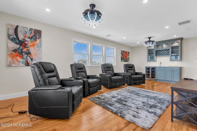living room featuring wet bar, beverage cooler, visible vents, and recessed lighting