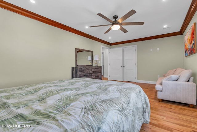 bedroom with recessed lighting, visible vents, light wood finished floors, and ornamental molding