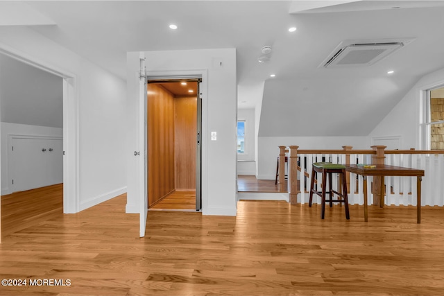 bonus room featuring recessed lighting, vaulted ceiling, visible vents, light wood-style floors, and baseboards