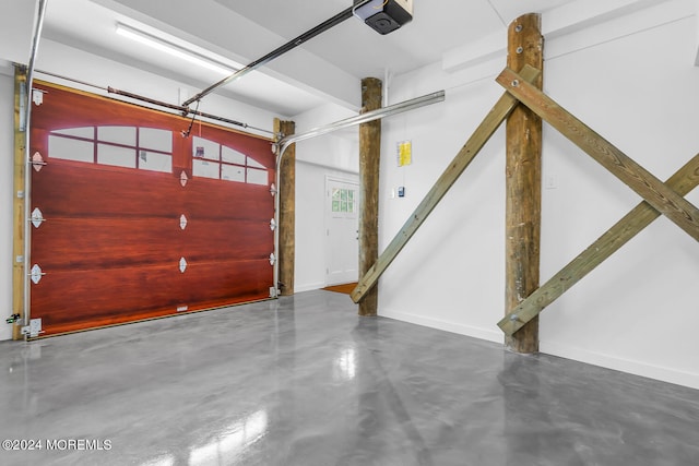 garage featuring baseboards and a garage door opener
