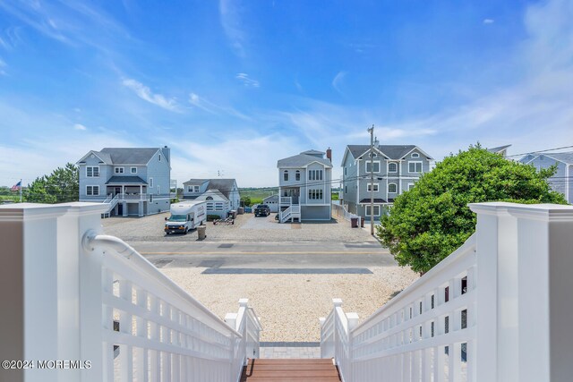 surrounding community featuring a residential view and stairway