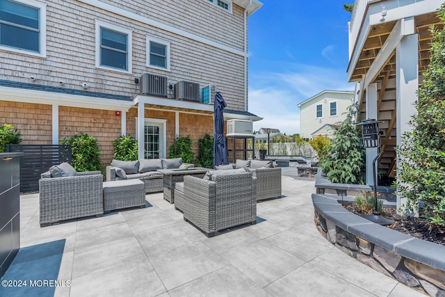 view of patio featuring outdoor lounge area and central air condition unit
