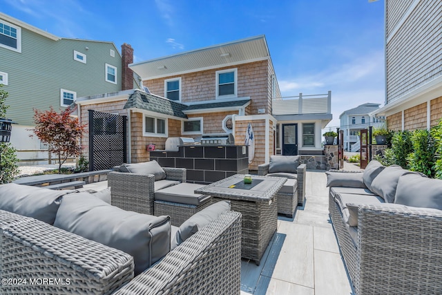 view of patio / terrace with an outdoor hangout area and fence