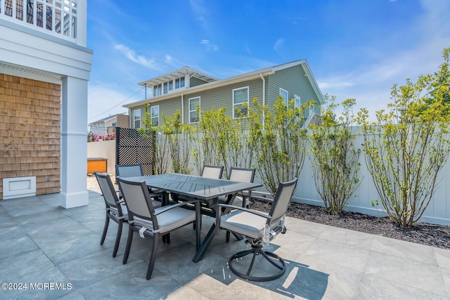 view of patio featuring a fenced backyard and outdoor dining space