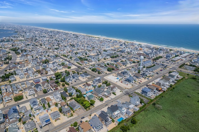 aerial view with a view of the beach and a water view