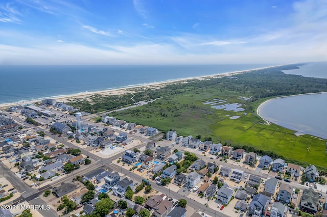 birds eye view of property with a water view and a residential view