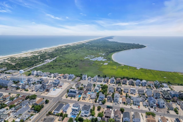 drone / aerial view featuring a water view and a residential view