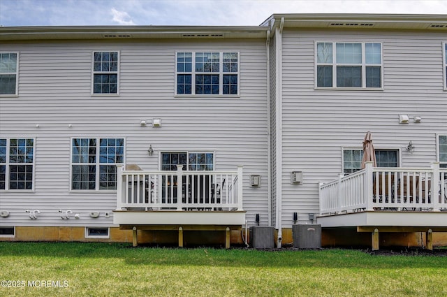 105 Pilot St, Marlboro, NJ 07746 - rear view of house featuring a wooden deck, a yard, and central AC