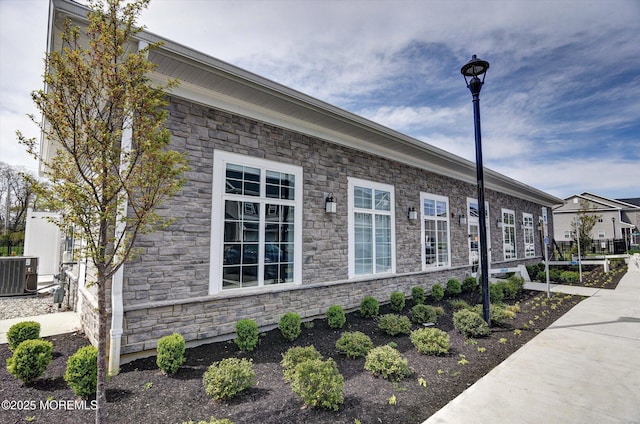 105 Pilot St, Marlboro, NJ 07746 - view of home's exterior with stone siding and central AC unit