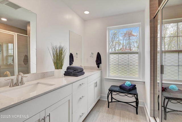 105 Pilot St, Marlboro, NJ 07746 - full bath with double vanity, visible vents, a sink, baseboards, and a stall shower