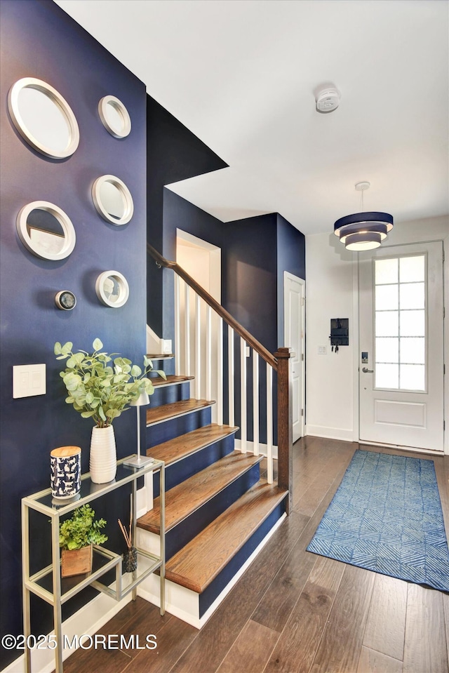 105 Pilot St, Marlboro, NJ 07746 - entrance foyer with baseboards, wood finished floors, and stairs