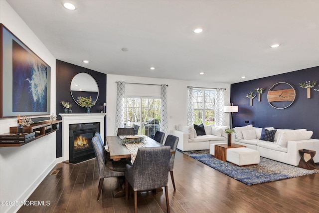 105 Pilot St, Marlboro, NJ 07746 - dining area with baseboards, a glass covered fireplace, wood finished floors, and recessed lighting
