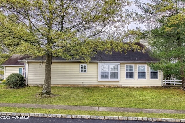 34 Meadows Ln, Manchester, NJ 08759 - back of house with a yard, a chimney, and fence