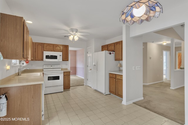 34 Meadows Ln, Manchester, NJ 08759 - kitchen with light countertops, a sink, ceiling fan, and white appliances