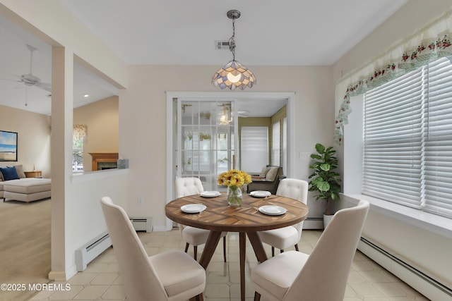 34 Meadows Ln, Manchester, NJ 08759 - dining space with ceiling fan, visible vents, a baseboard heating unit, and baseboards