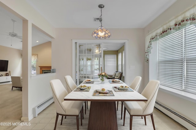 34 Meadows Ln, Manchester, NJ 08759 - dining room featuring a baseboard heating unit, ceiling fan, and visible vents
