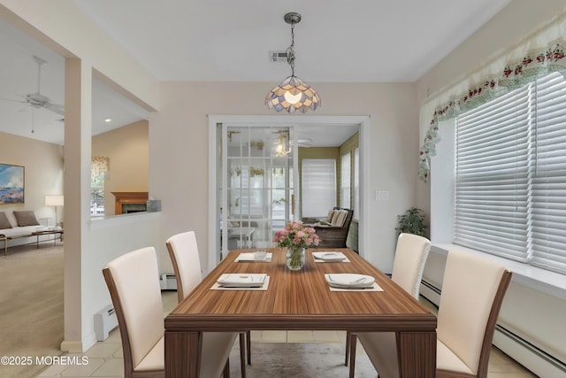 34 Meadows Ln, Manchester, NJ 08759 - dining room with baseboard heating, visible vents, a ceiling fan, and a baseboard radiator
