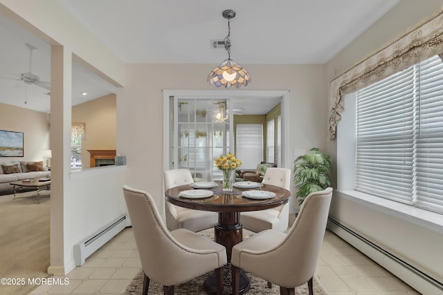 34 Meadows Ln, Manchester, NJ 08759 - dining space with a healthy amount of sunlight, a ceiling fan, and a baseboard radiator