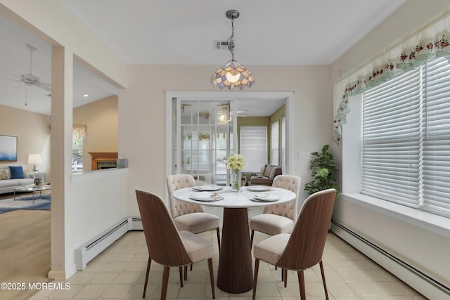 34 Meadows Ln, Manchester, NJ 08759 - dining area featuring light floors, visible vents, a ceiling fan, and baseboard heating