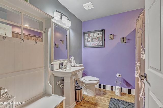 627 Huntington Dr Unit C, Lakewood, NJ 08701 - bathroom featuring toilet, wood finished floors, and a shower with curtain
