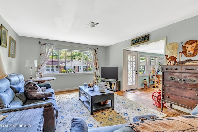 627 Huntington Dr Unit C, Lakewood, NJ 08701 - living room featuring wood finished floors and baseboards