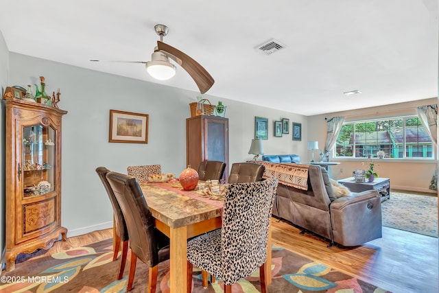 627 Huntington Dr Unit C, Lakewood, NJ 08701 - dining area with light wood-style flooring, a ceiling fan, and baseboards