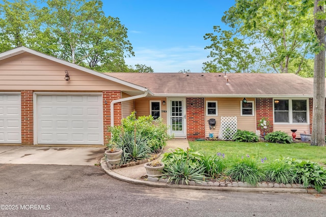 627 Huntington Dr Unit C, Lakewood, NJ 08701 - ranch-style house featuring brick siding, driveway, an attached garage, roof with shingles, and a front yard
