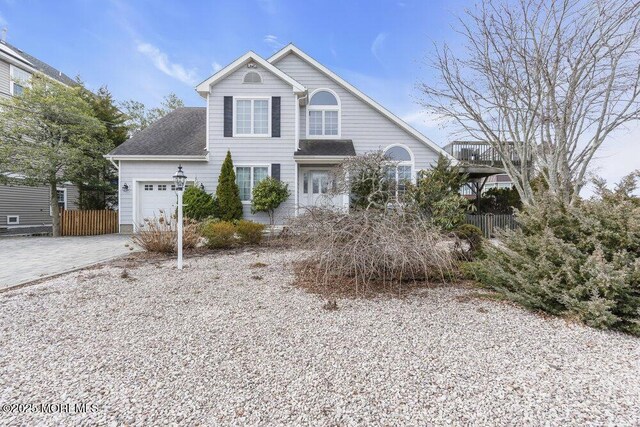 42 Circle Ct, Brick, NJ 08723 - view of front facade featuring an attached garage, driveway, a shingled roof, and fence