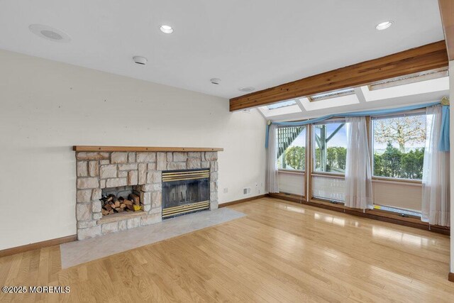 42 Circle Ct, Brick, NJ 08723 - unfurnished living room with wood finished floors, a stone fireplace, beamed ceiling, baseboards, and recessed lighting