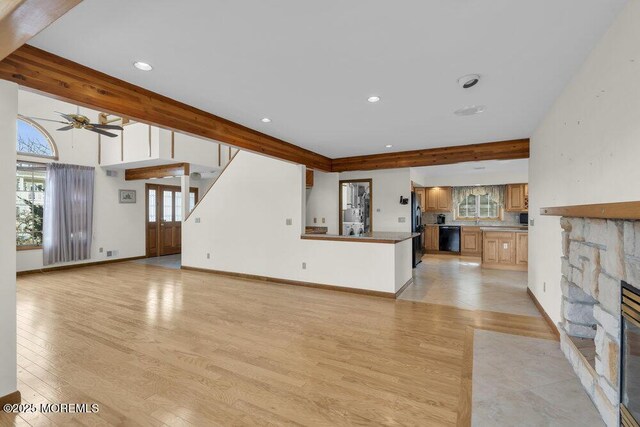 42 Circle Ct, Brick, NJ 08723 - unfurnished living room with ceiling fan, recessed lighting, a stone fireplace, and light wood-style flooring