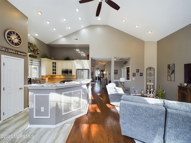 89 Pebble Beach Blvd, Jackson, NJ 08527 - living area with high vaulted ceiling, a ceiling fan, light wood-style floors, and recessed lighting